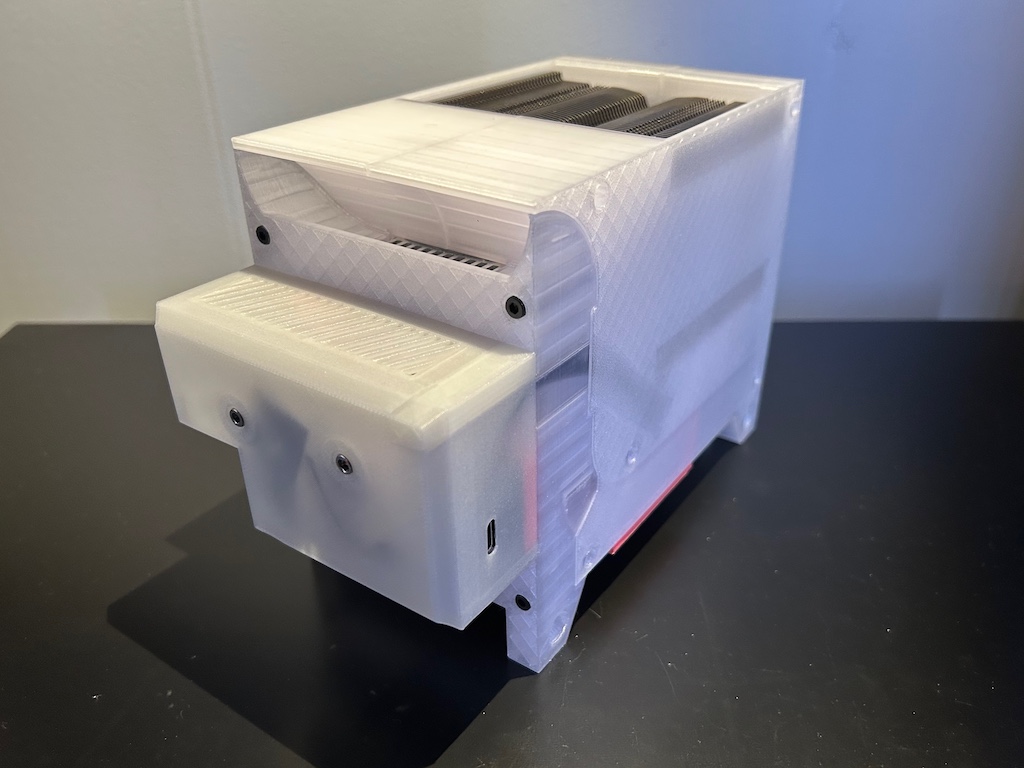 A 3D printed box with heatsinks and electronics visible inside